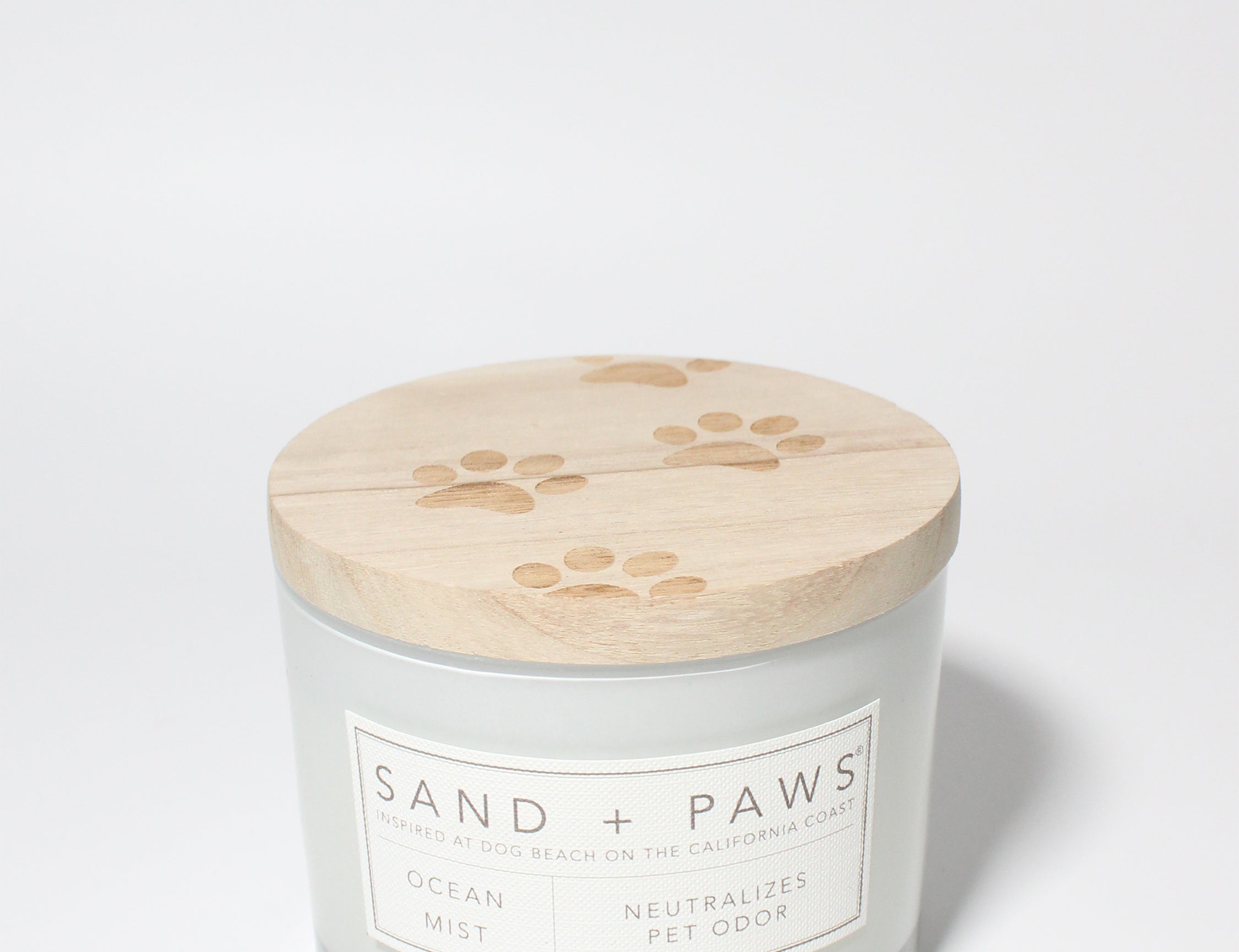 Sand + Paws Ocean Mist 12 oz scented candle White vessel with Carved Paw Print lid
