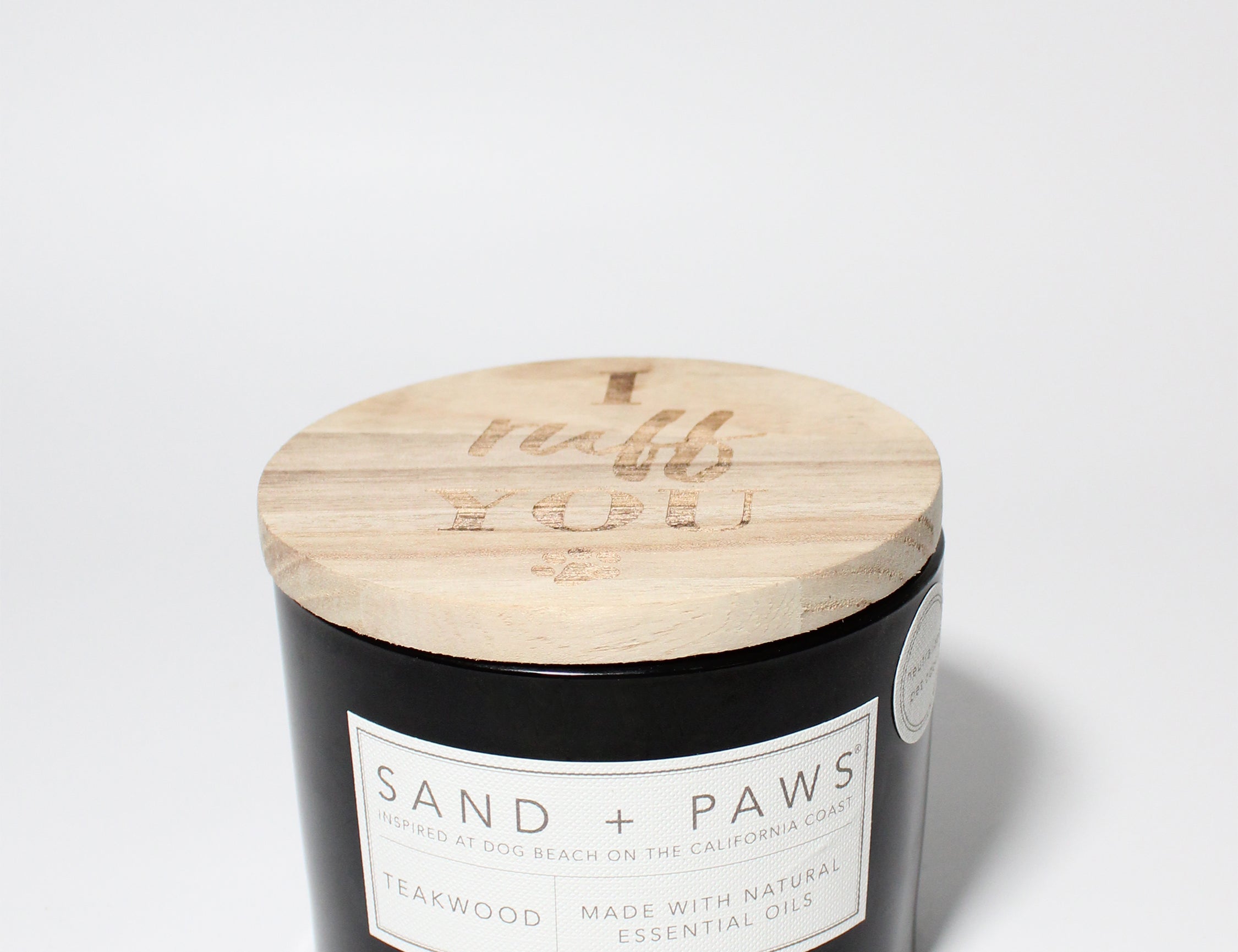 Sand + Paws Teakwood 12 oz scented candle Black vessel with Carved I ruff you lid