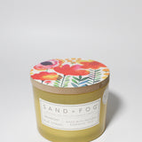 Midnight Blue Citrus 12 oz scented candle Yellow vessel with Painted Flower garden lid