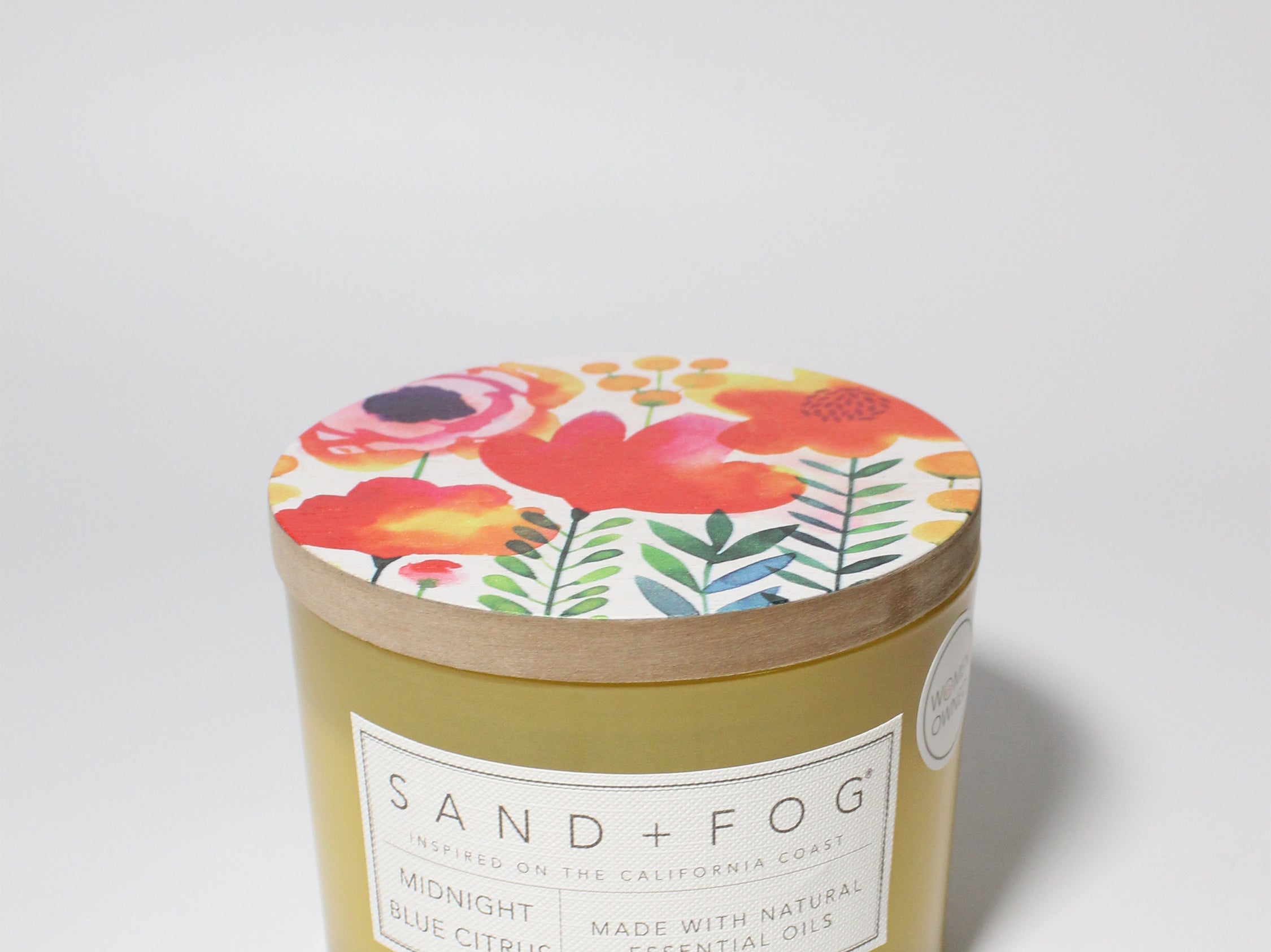 Midnight Blue Citrus 12 oz scented candle Yellow vessel with Painted Flower garden lid
