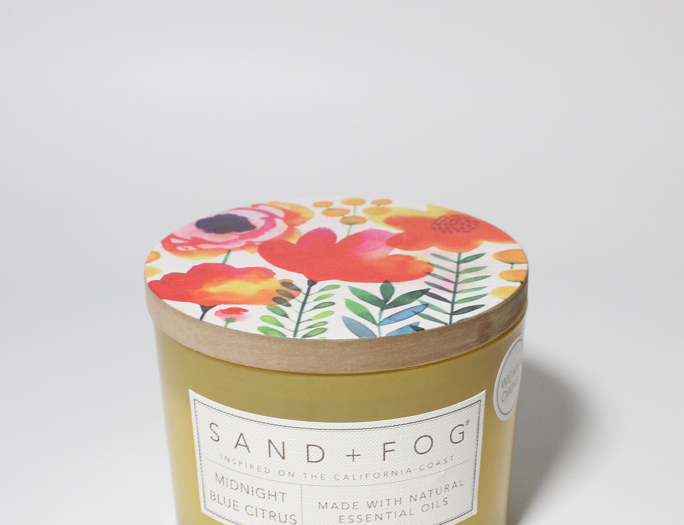 Midnight Blue Citrus 12 oz scented candle Yellow vessel with Painted Flower garden lid
