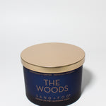 The Woods 12 oz scented candle Navy vessel with Copper lid