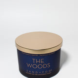 The Woods 12 oz scented candle Navy vessel with Copper lid