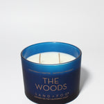 The Woods 12 oz scented candle Navy vessel with Copper lid
