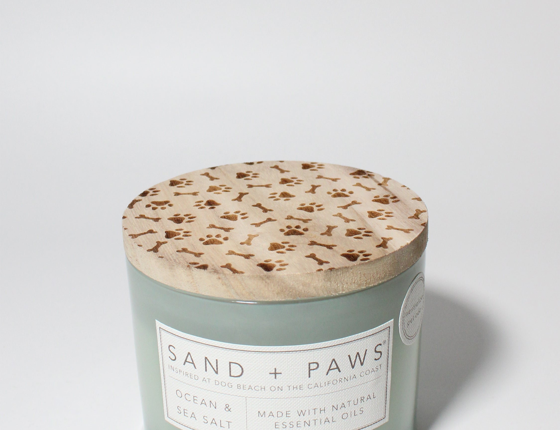 Sand + Paws Ocean & Sea Salt 12 oz scented candle Seaglass vessel with Carved Paws and Bones lid