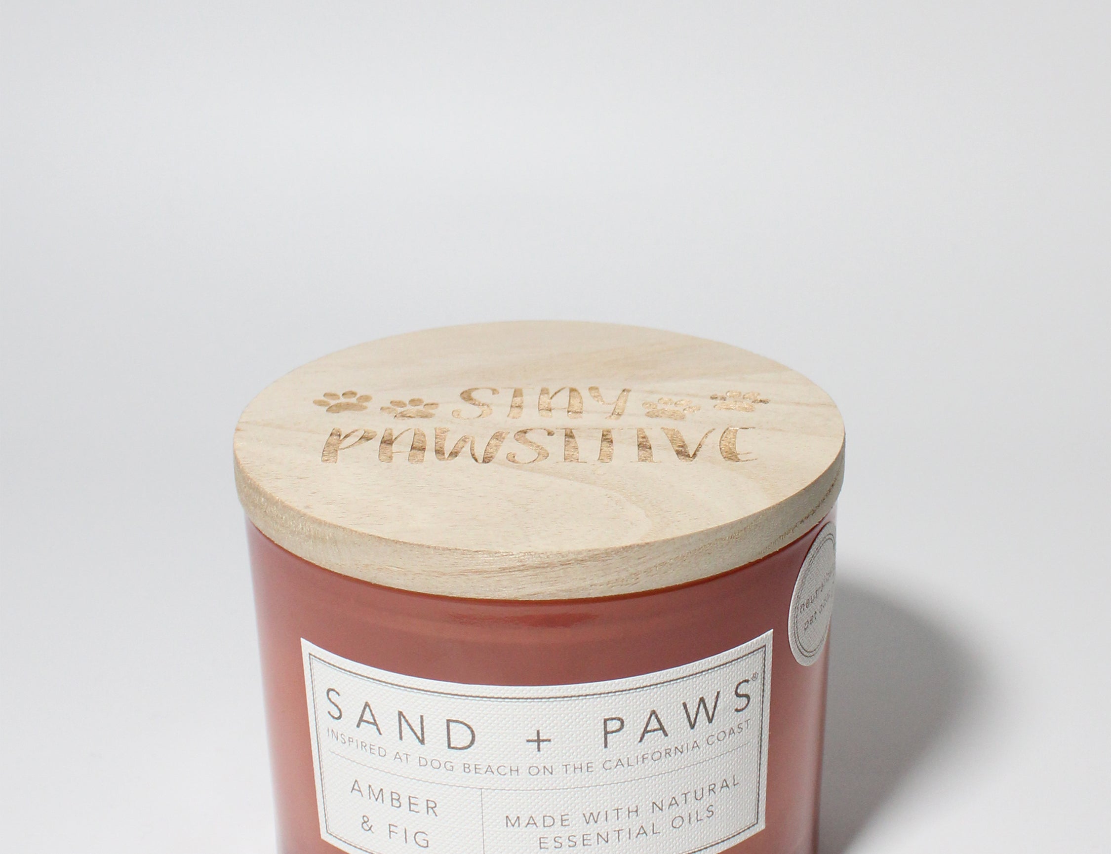 Sand + Paws Amber & Fig 12 oz scented candle Melon vessel with Carved Stay Pawsitive Lid