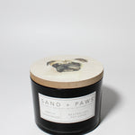 Sand + Paws Vanilla Sandalwood 12 oz scented candle Black vessel with Painted Pug Lid