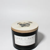 Sand + Paws Vanilla Sandalwood 12 oz scented candle Black vessel with Painted Pug Lid