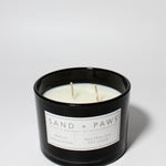 Sand + Paws Vanilla Sandalwood 12 oz scented candle Black vessel with Painted Pug Lid