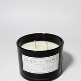 Sand + Paws Vanilla Sandalwood 12 oz scented candle Black vessel with Painted Pug Lid
