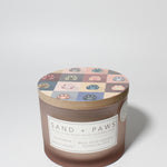 Sand + Paws California Beach House 12 oz scented candle Blush vessel with Painted Paw Grid lid
