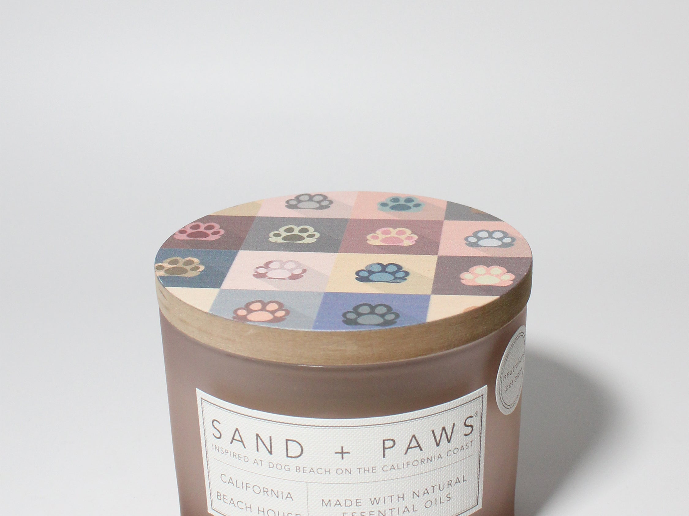 Sand + Paws California Beach House 12 oz scented candle Blush vessel with Painted Paw Grid lid