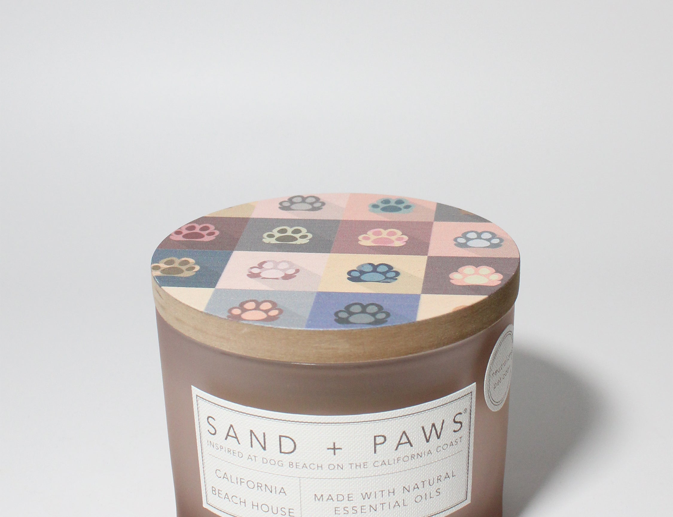 Sand + Paws California Beach House 12 oz scented candle Blush vessel with Painted Paw Grid lid
