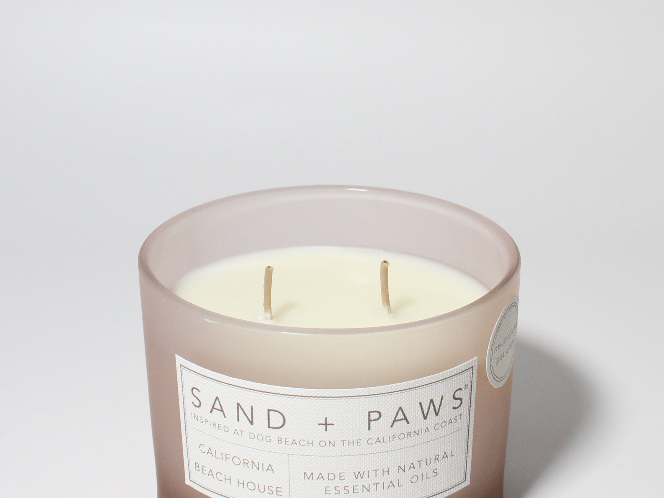 Sand + Paws California Beach House 12 oz scented candle Blush vessel with Painted Paw Grid lid