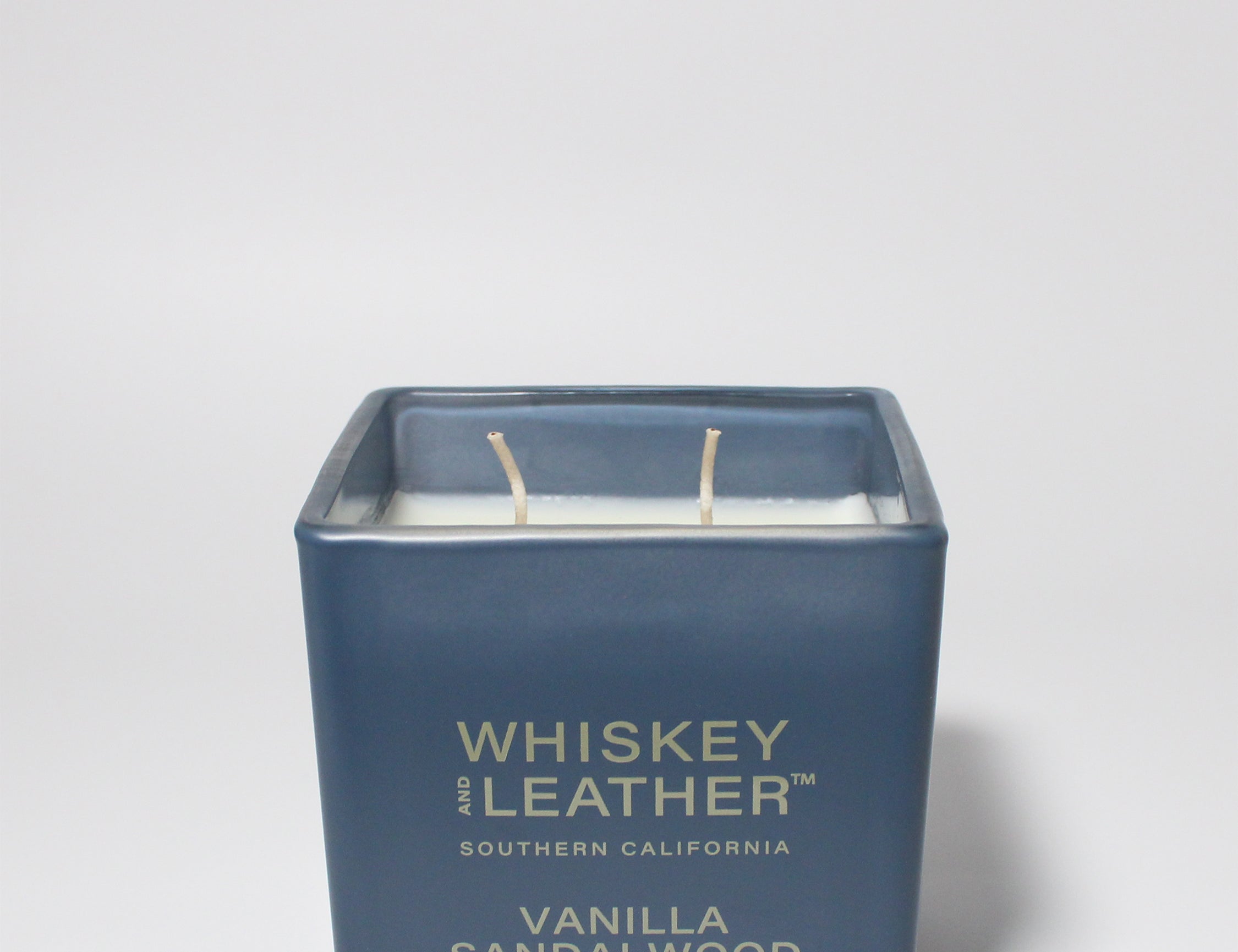 Whiskey and Leather Vanilla Sandalwood 16 oz scented candle Blue vessel with blue lid