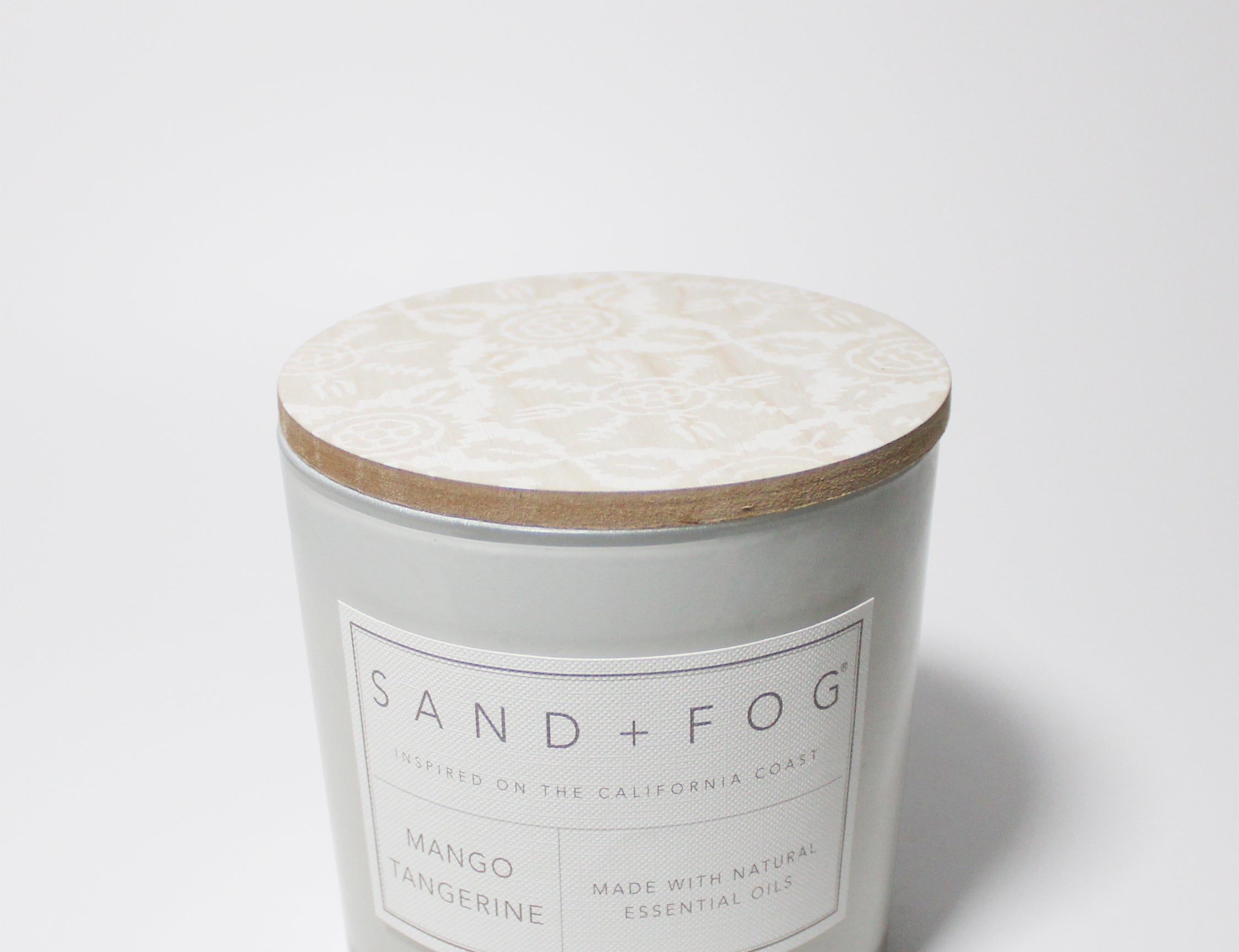Mango Tangerine 21 oz candle with a wood lid