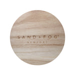 Wood lid with "Sand + Fog Newport" carved