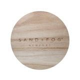 Wood lid with "Sand + Fog Newport" carved