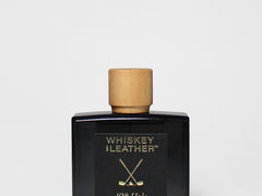 100 ml cologne bottle with black glass and cork; label reads "Whiskey Leather"