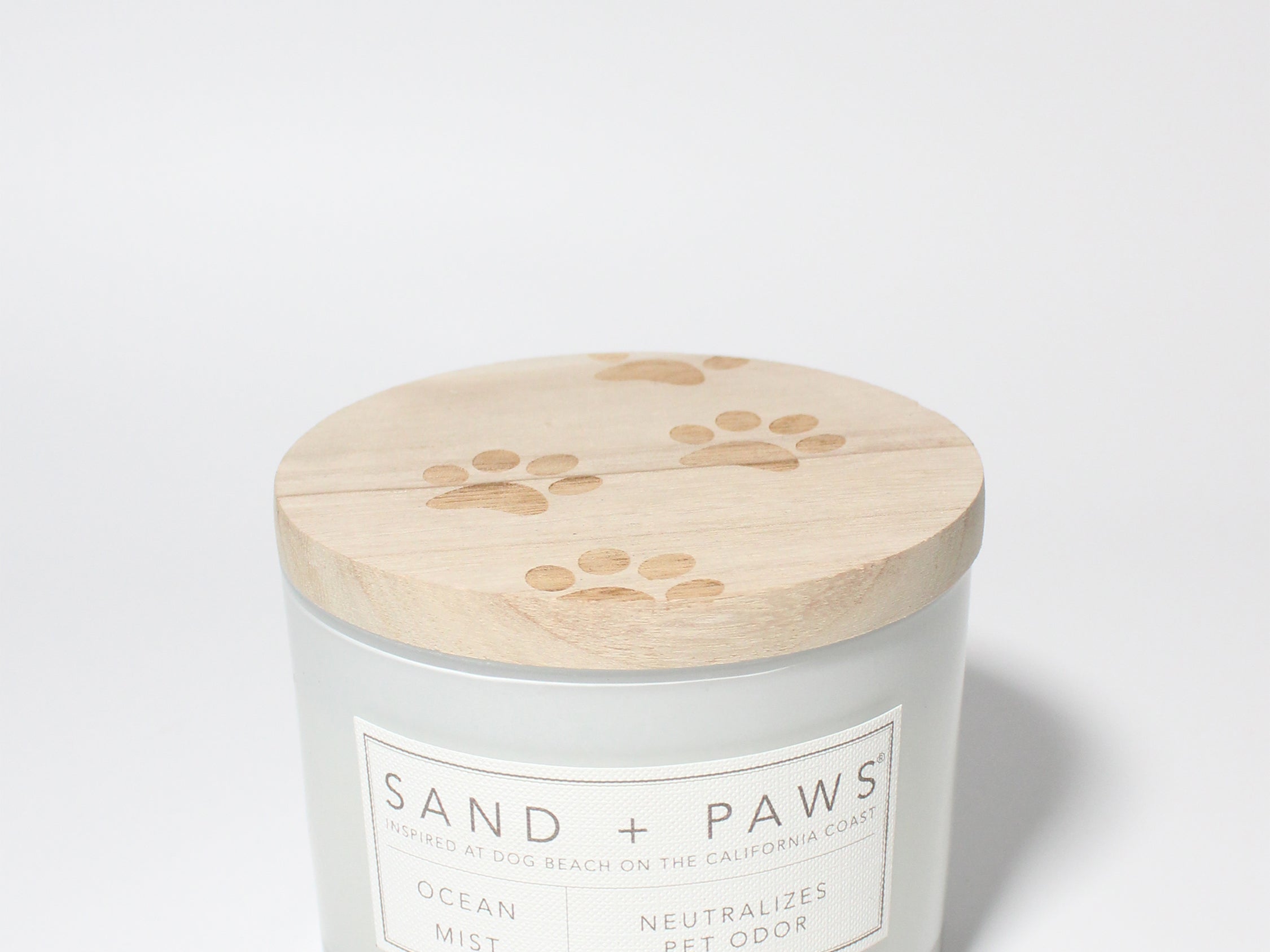 Sand + Paws Ocean Mist 12 oz scented candle White vessel with Carved Paw Print lid