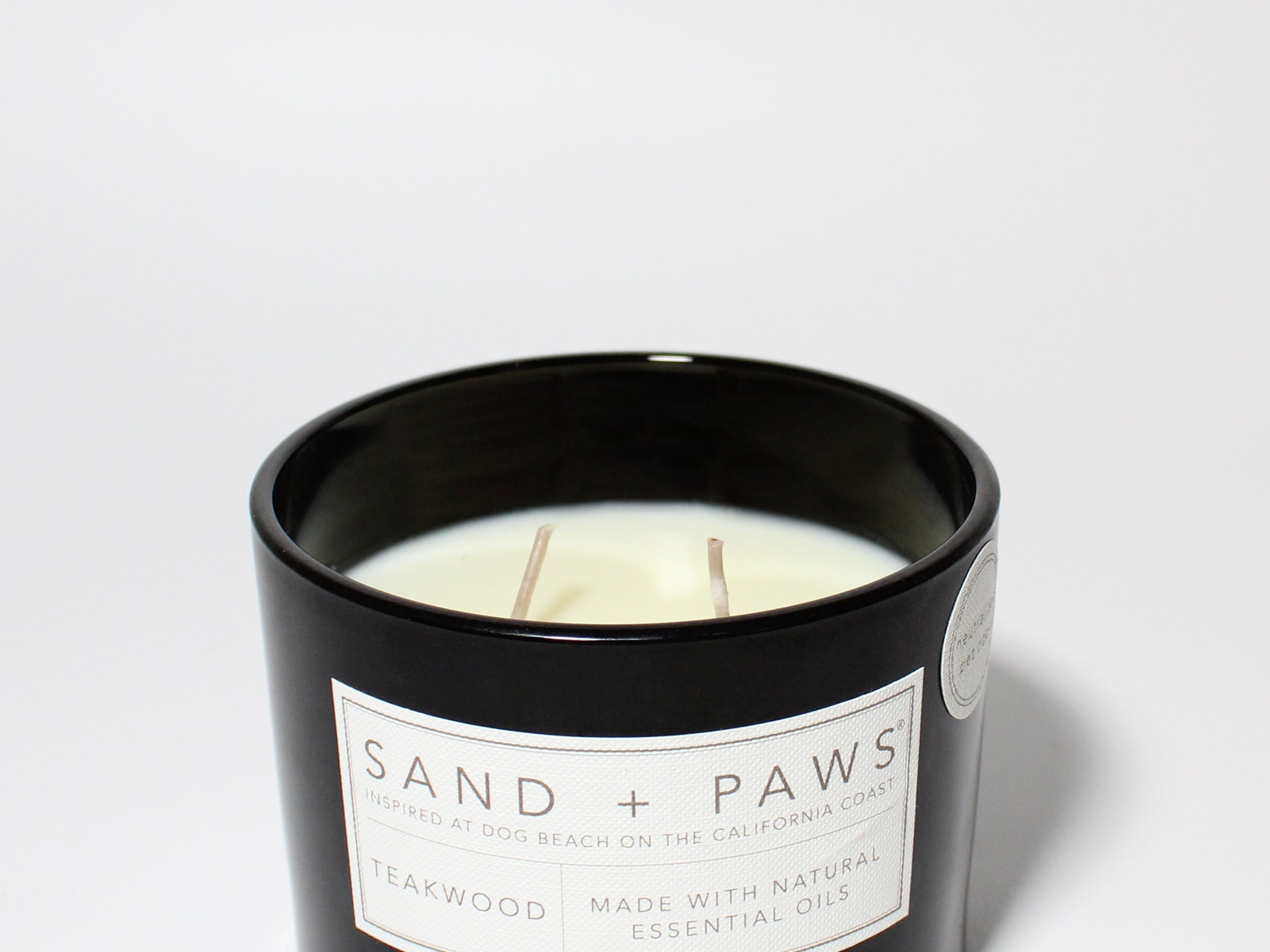 Sand + Paws Teakwood 12 oz scented candle Black vessel with Carved I ruff you lid