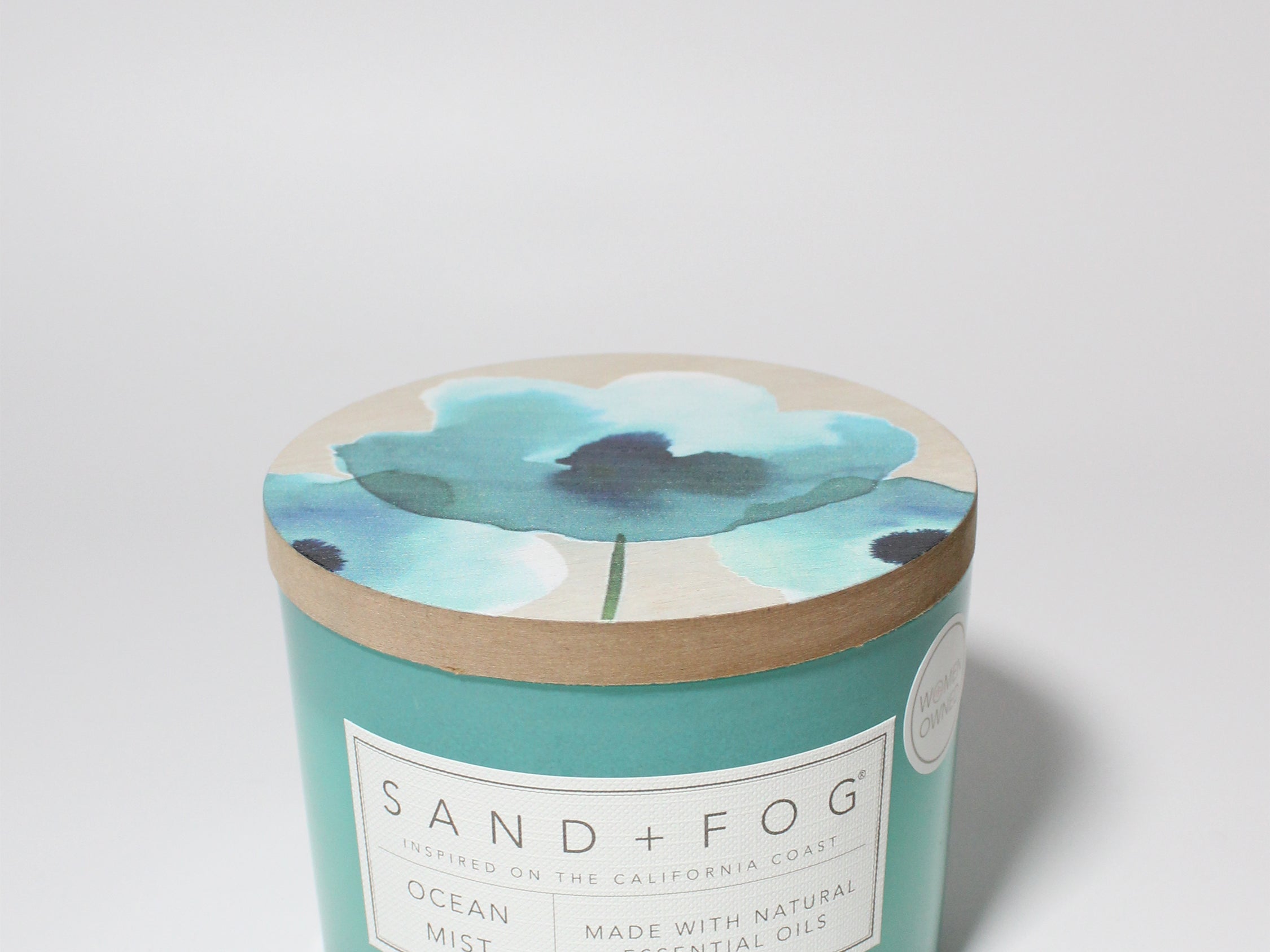 Ocean Mist 12 oz scented candle Aqua vessel with Painted Poppy lid