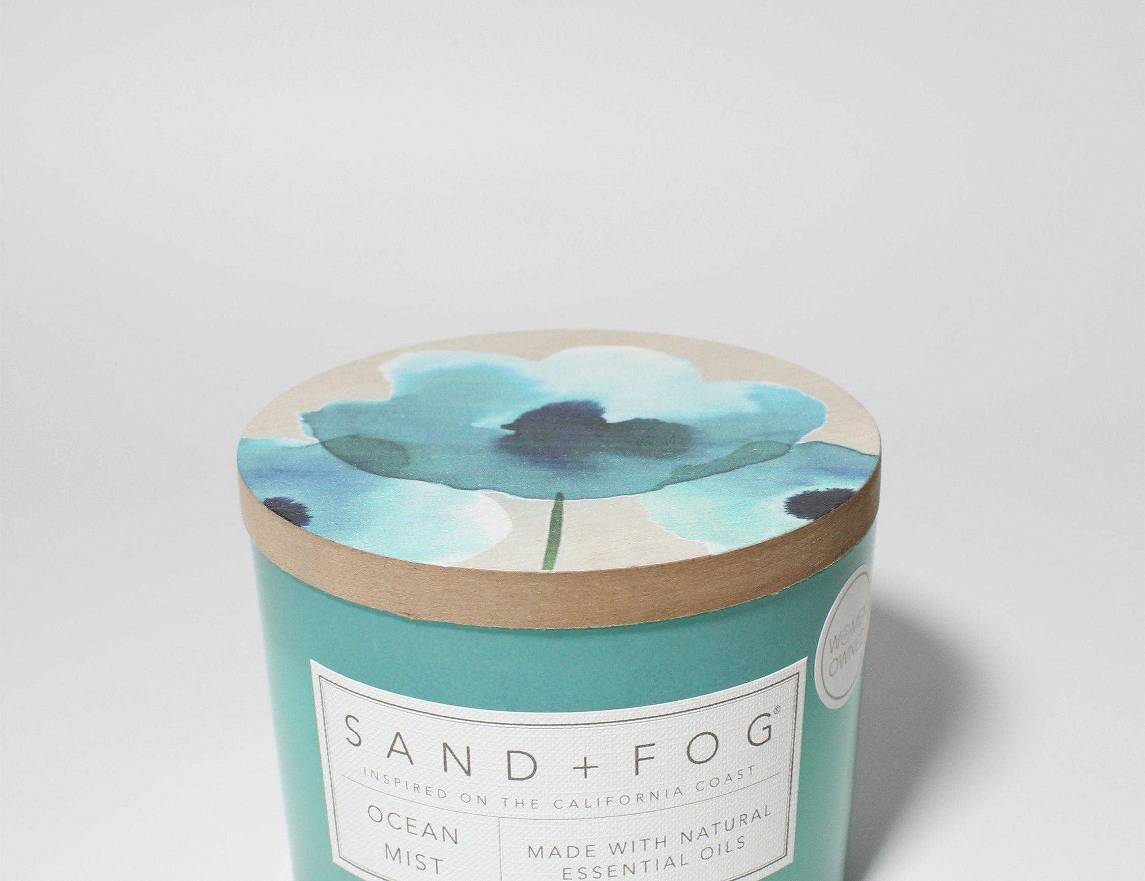 Ocean Mist 12 oz scented candle Aqua vessel with Painted Poppy lid