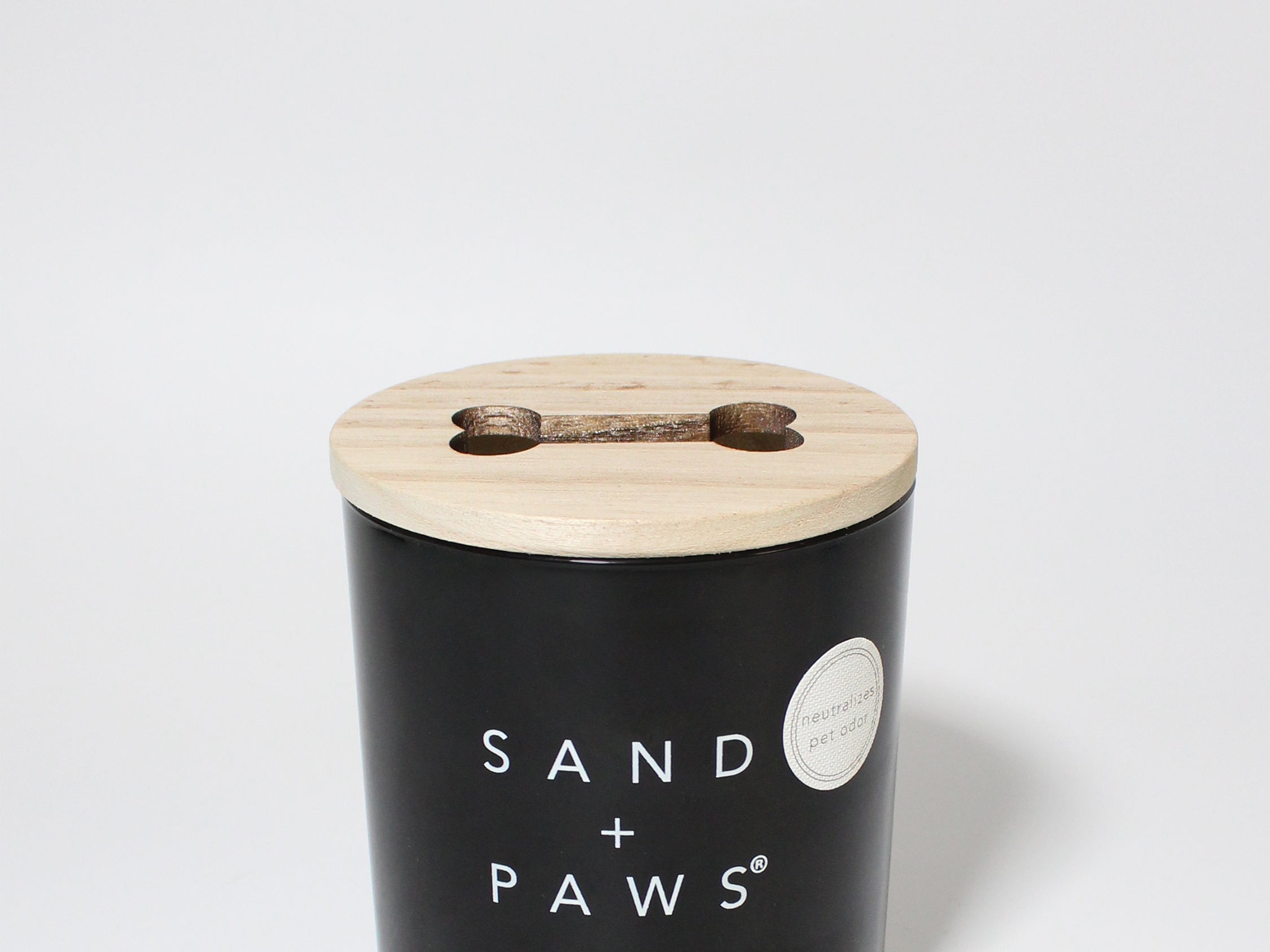 Sand + Paws Teakwood 11.5 oz scented candle Black vessel with cut out Bone wood lid