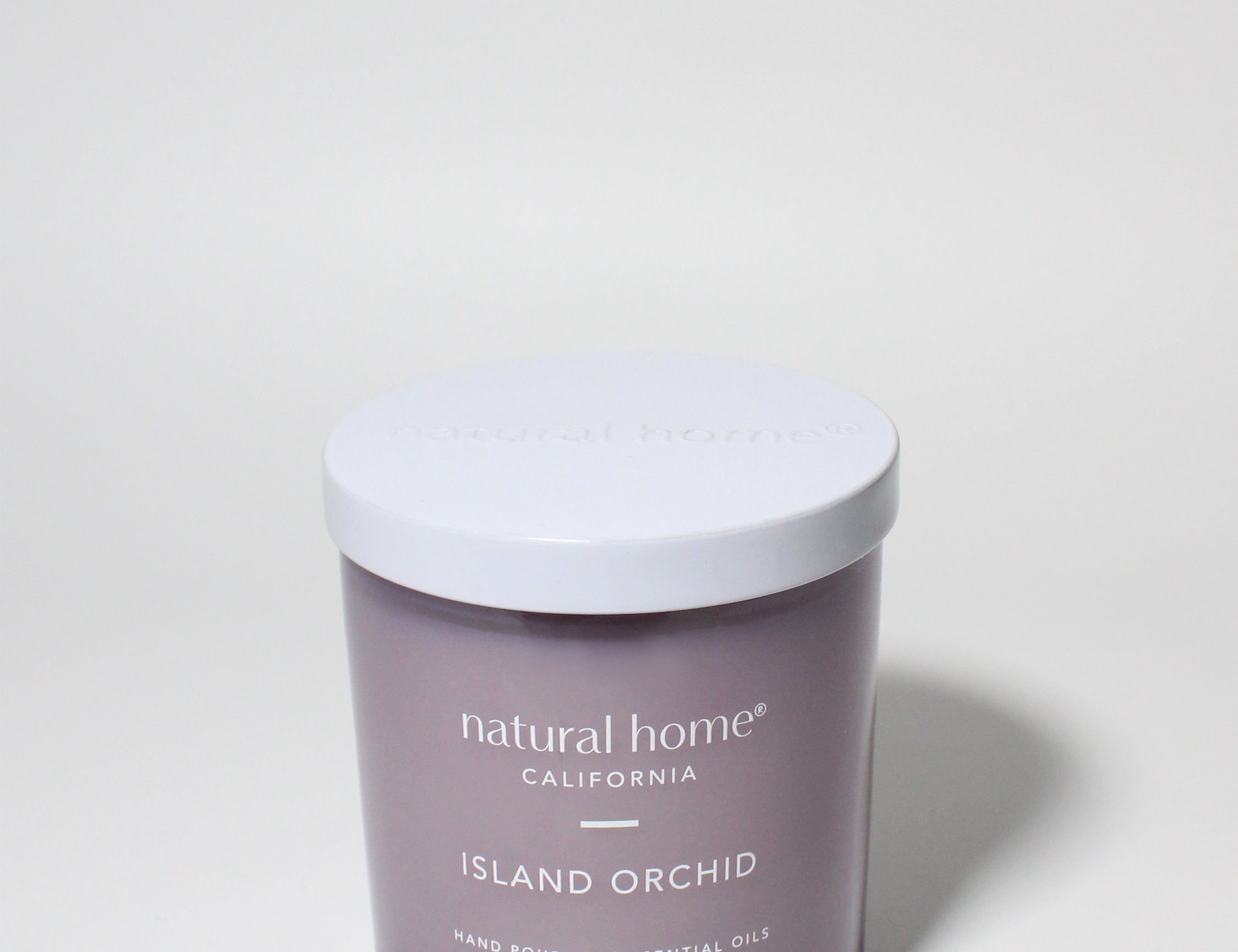 Island Orchid Natural Home 11.5 oz scented candle Purple vessel with solid metal lid