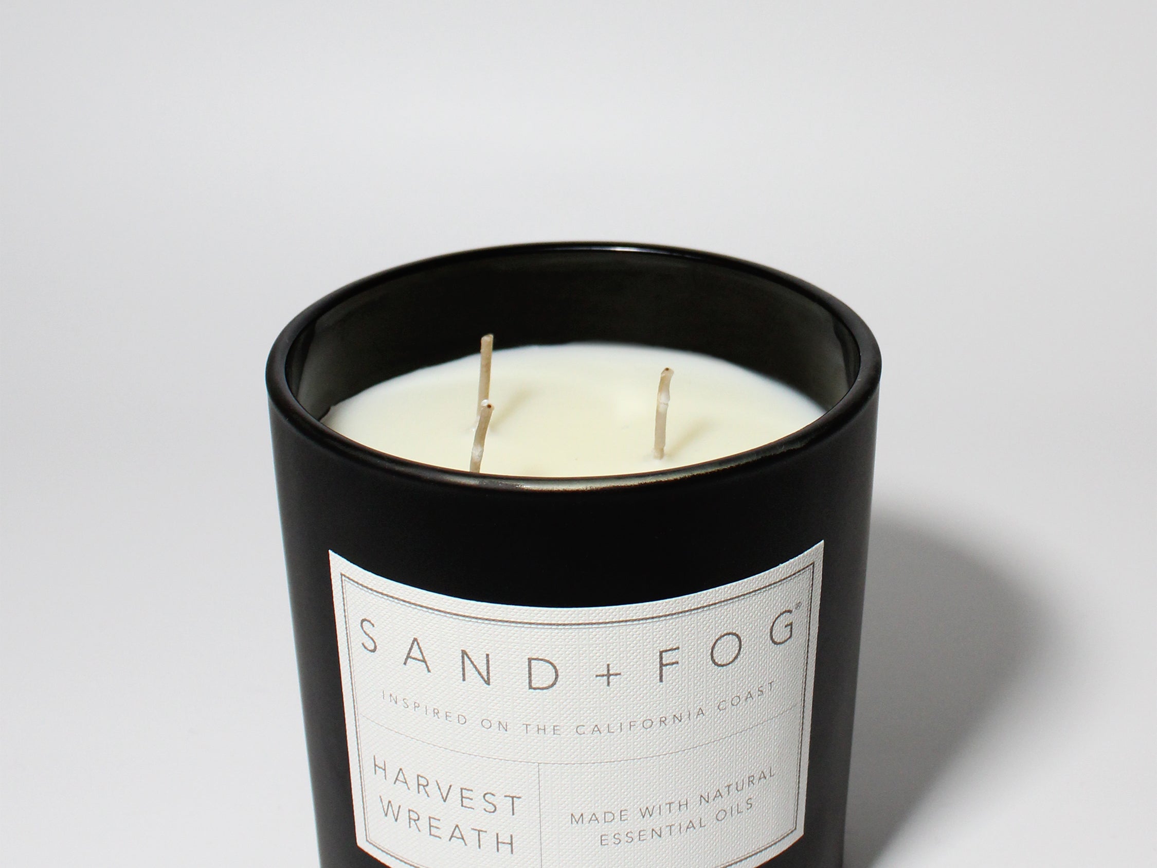 Harvest Wreath 21 oz scented candle Black vessel with Painted Pumpkins lid