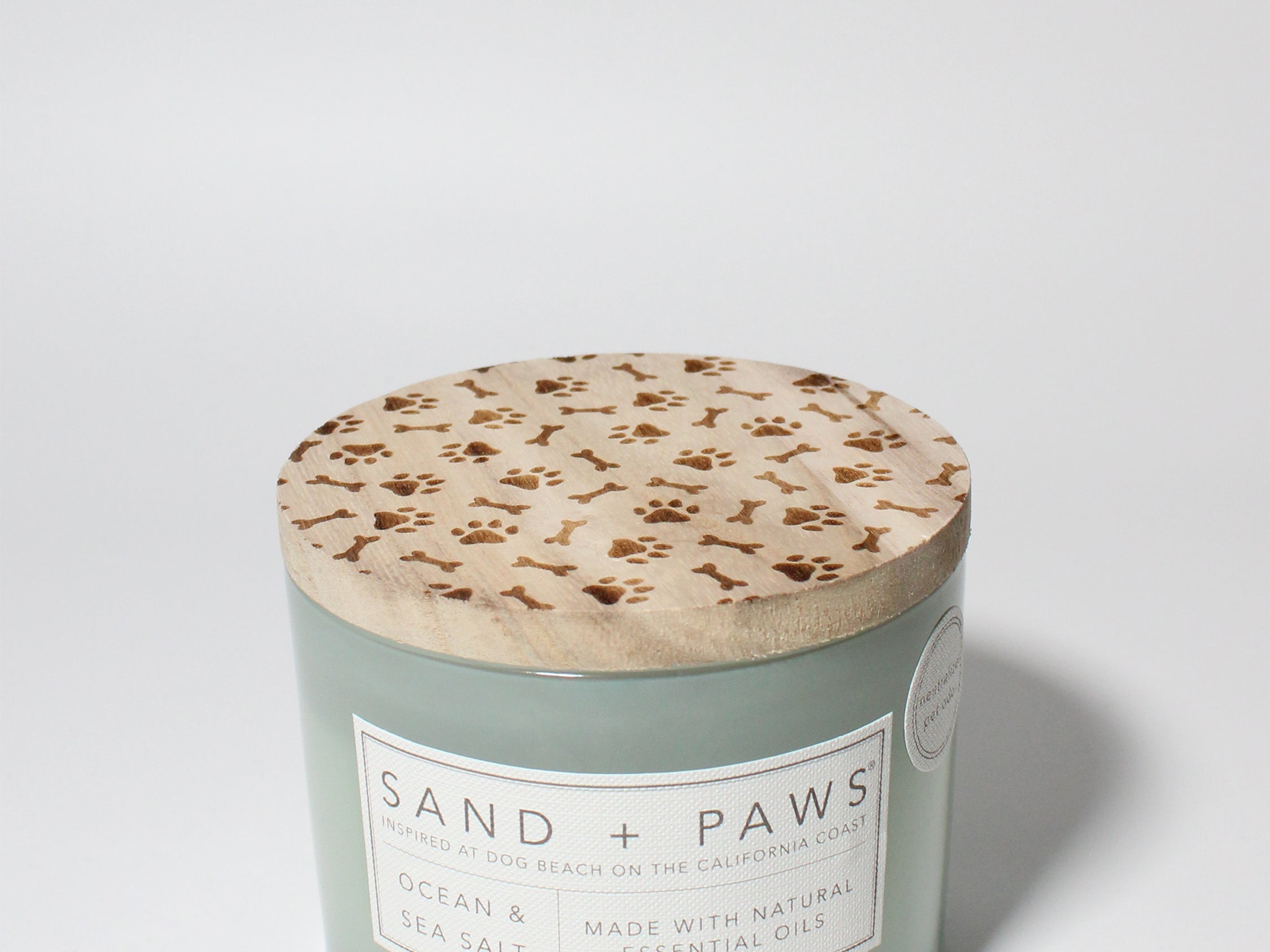 Sand + Paws Ocean & Sea Salt 12 oz scented candle Seaglass vessel with Carved Paws and Bones lid