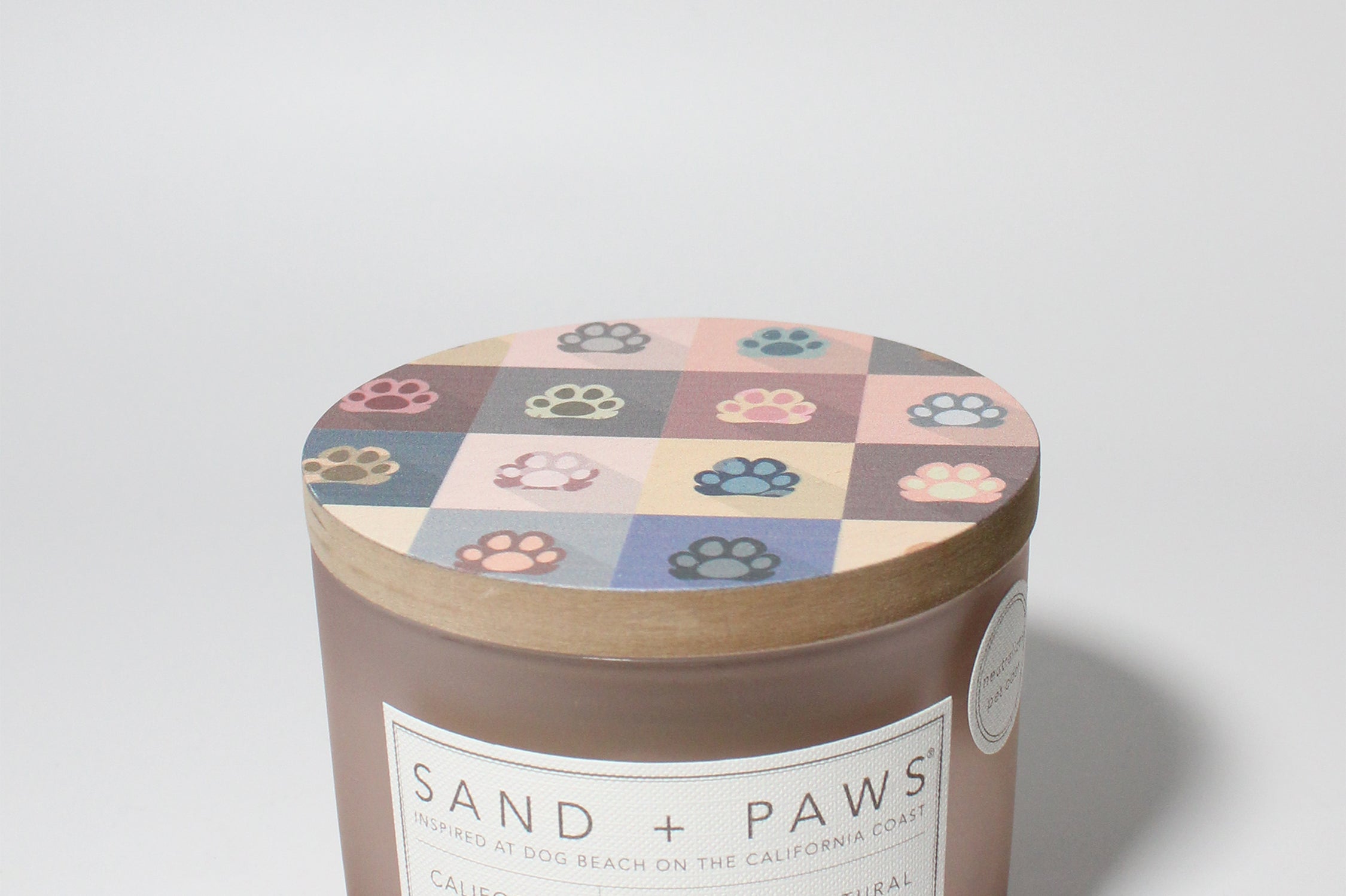Sand + Paws California Beach House 12 oz scented candle Blush vessel with Painted Paw Grid lid