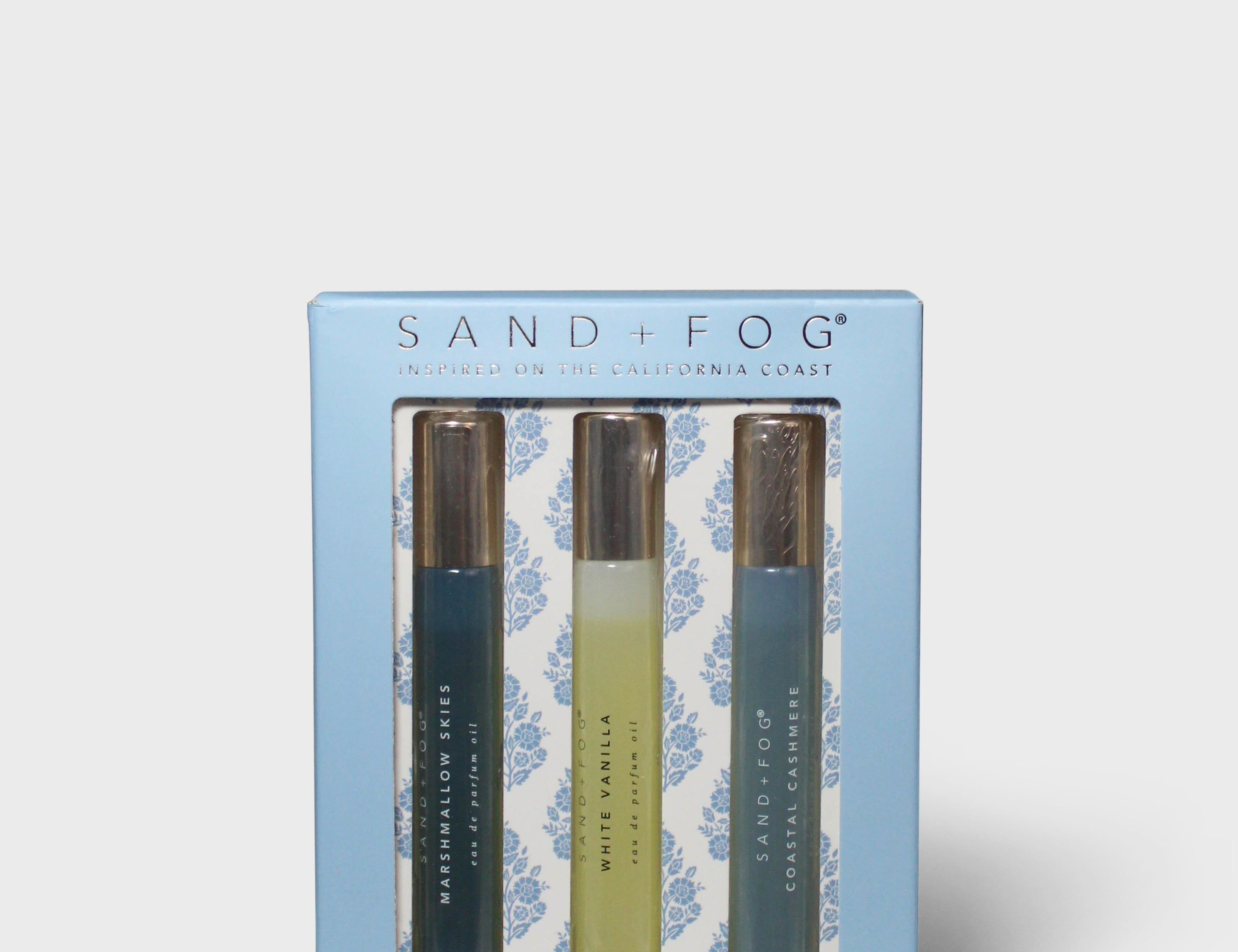 Sand+Fog perfume oil rollerball set box with three roller bottles, blue and beige