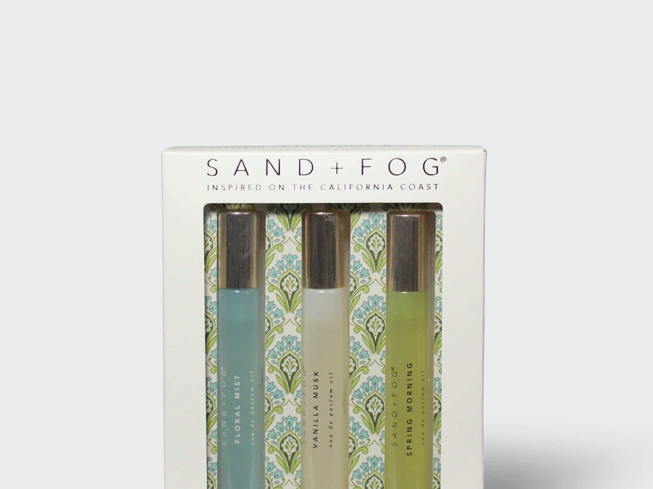 Boxed perfume oil set with slim glass vials and patterned labels