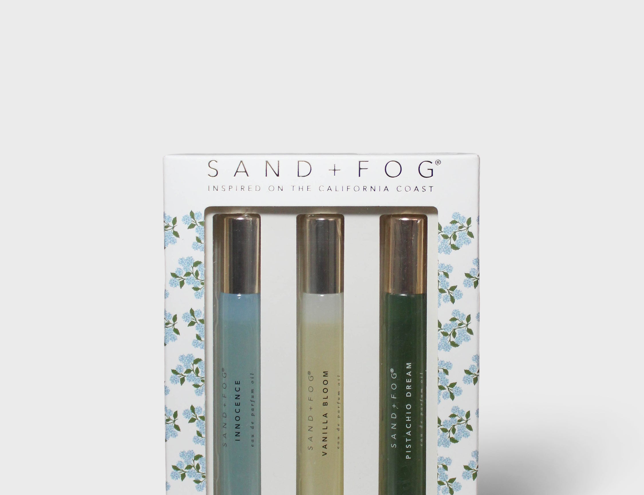 Sand+Fog perfume oil rollerball set: three bottles in floral window box