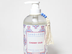 Liquid hand soap in clear pump bottle, SAND+FOG Cherry Oud, floral label