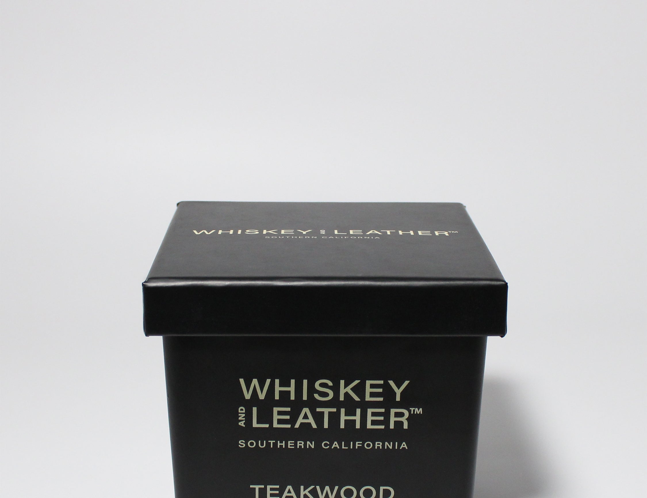 Whiskey and Leather Teakwood 16 oz scented candle Black vessel with black lid
