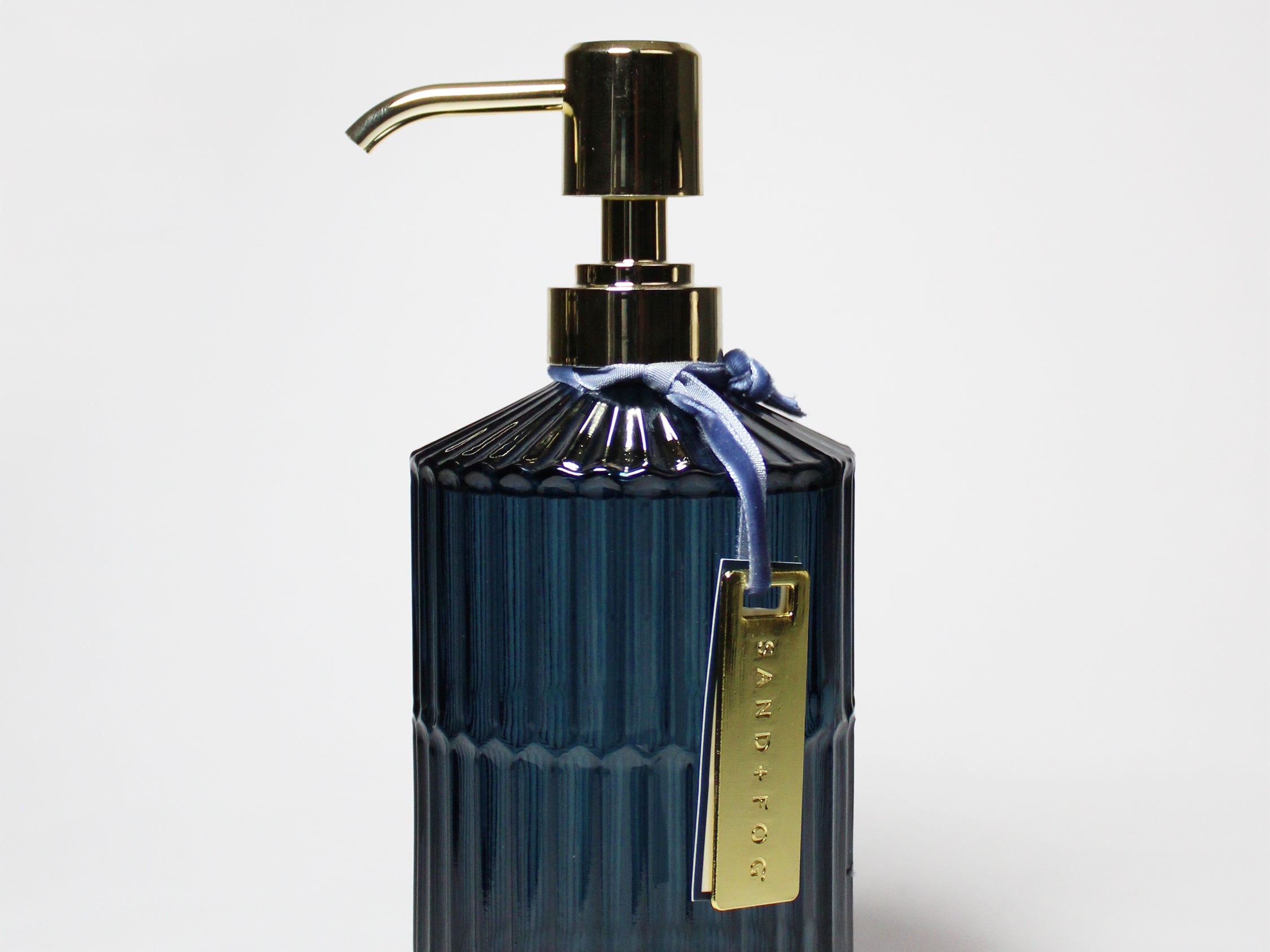 Dark blue ribbed glass liquid hand soap dispenser with gold pump