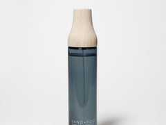 Coastal Cashmere linen spray bottle with wooden cap and dark blue label