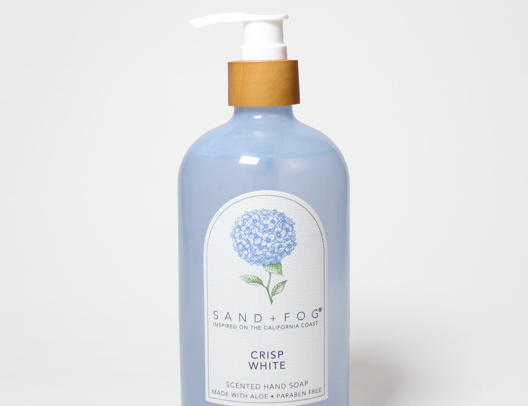 Blue liquid hand soap bottle with white pump, illustrated hydrangea label