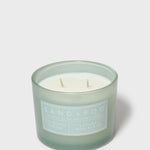 12 oz scented candle in frosted green jar with two wicks and visible wax