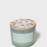 Pistachio Dream 12 oz scented candle in frosted green glass with floral lid