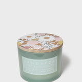 Pistachio Dream 12 oz scented candle in frosted green glass with floral lid