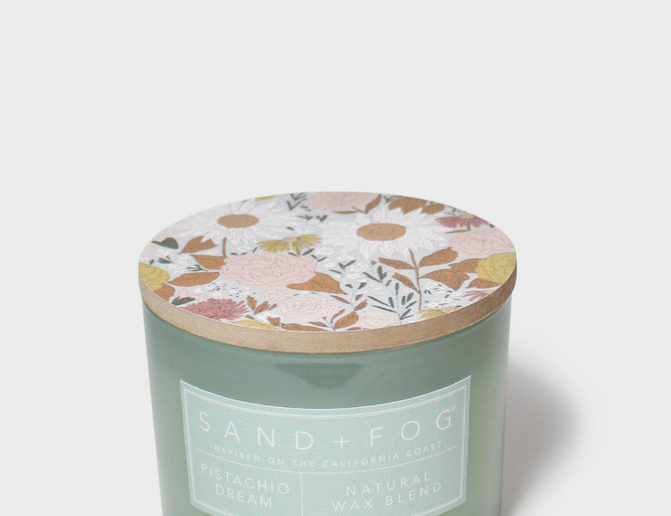 Pistachio Dream 12 oz scented candle in frosted green glass with floral lid