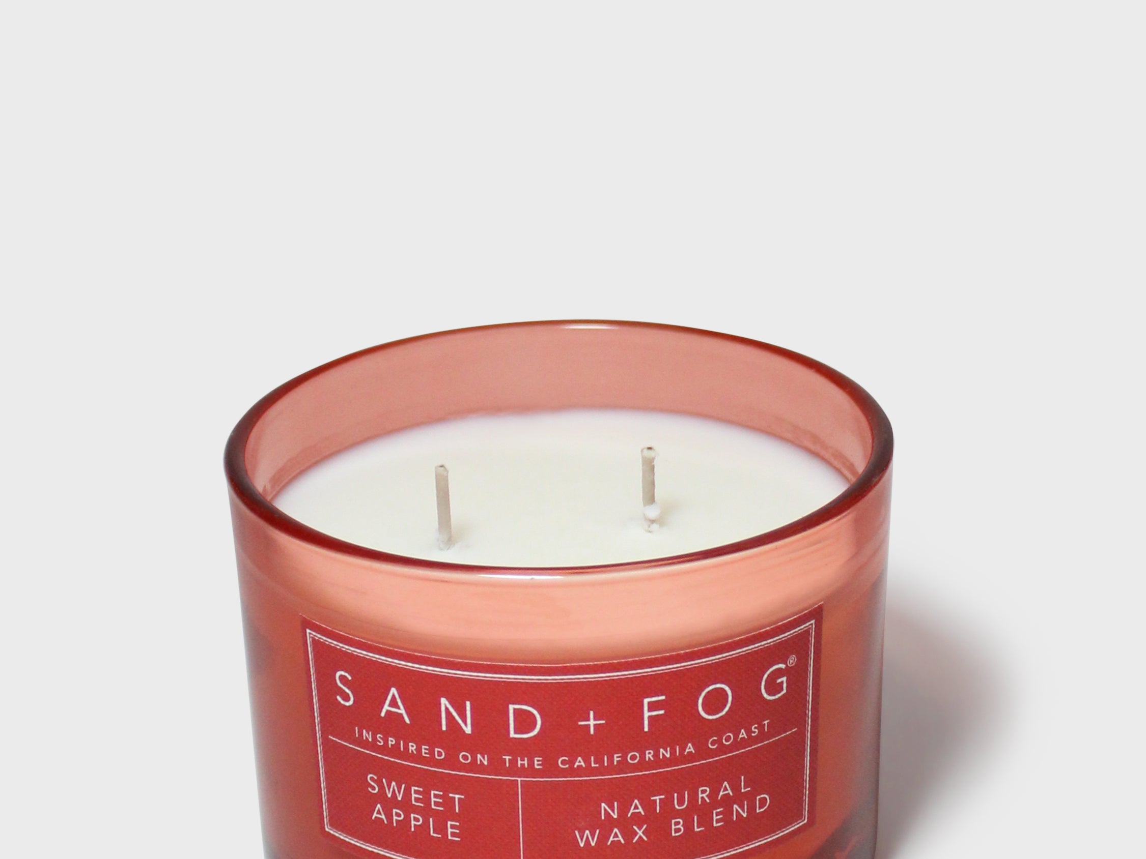 SAND + FOG Sweet Apple scented candle, red glass jar with two wicks