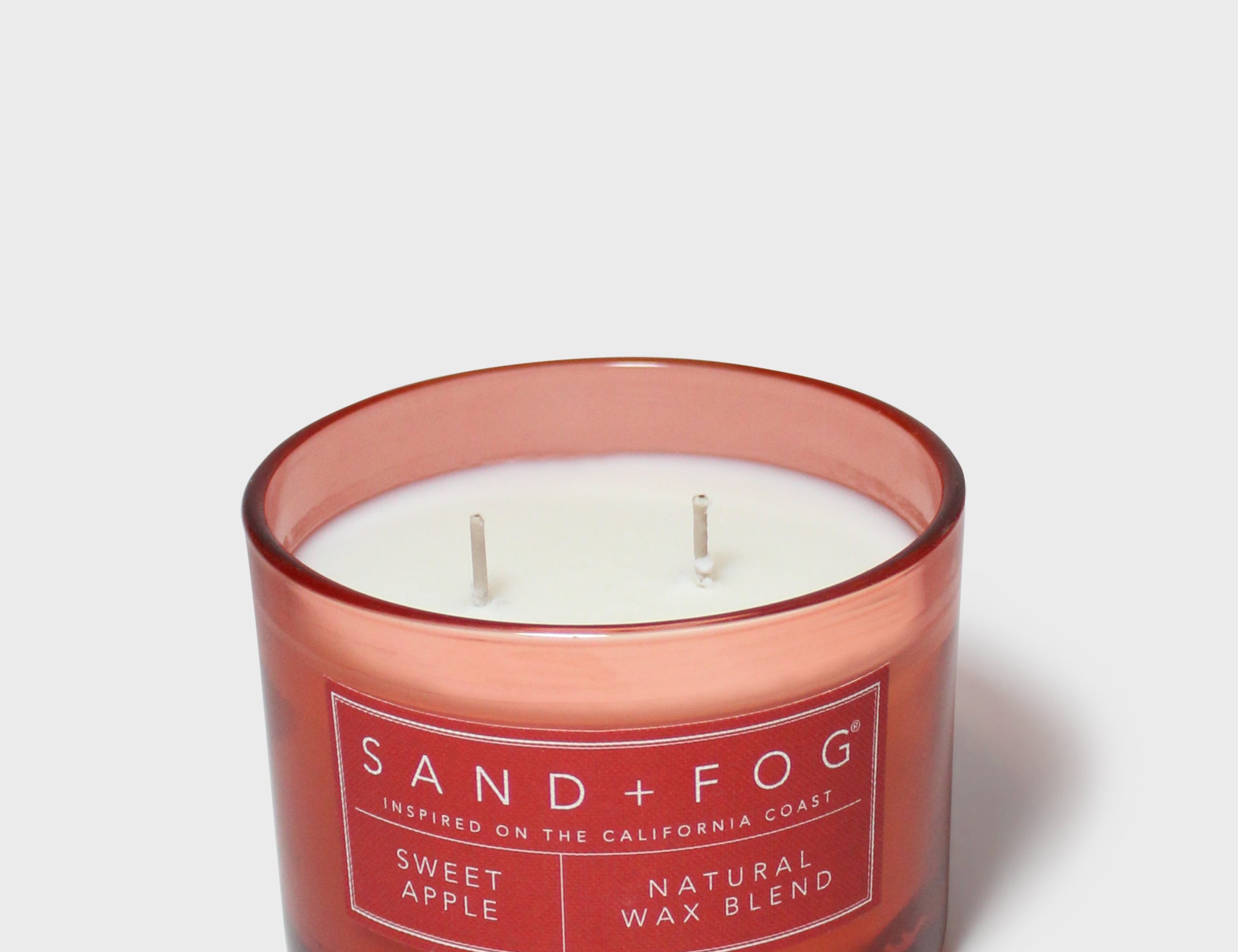 SAND + FOG Sweet Apple scented candle, red glass jar with two wicks