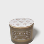 SAND + FOG scented candle in dark brown glass jar with floral lid