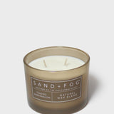 SAND + FOG scented candle in dark brown glass jar with two wicks, natural wax blend