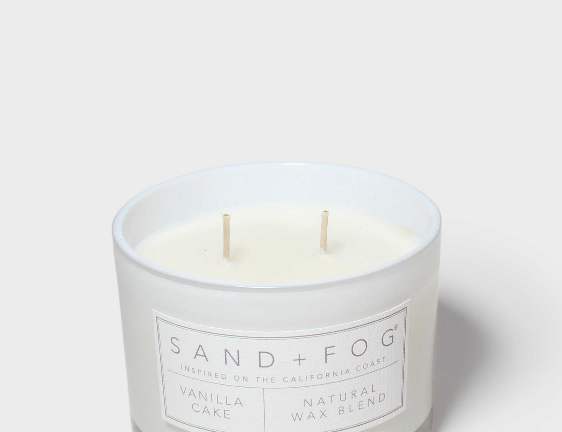 12 oz vanilla cake scented candle with white wax and three wicks, Sand + Fog label