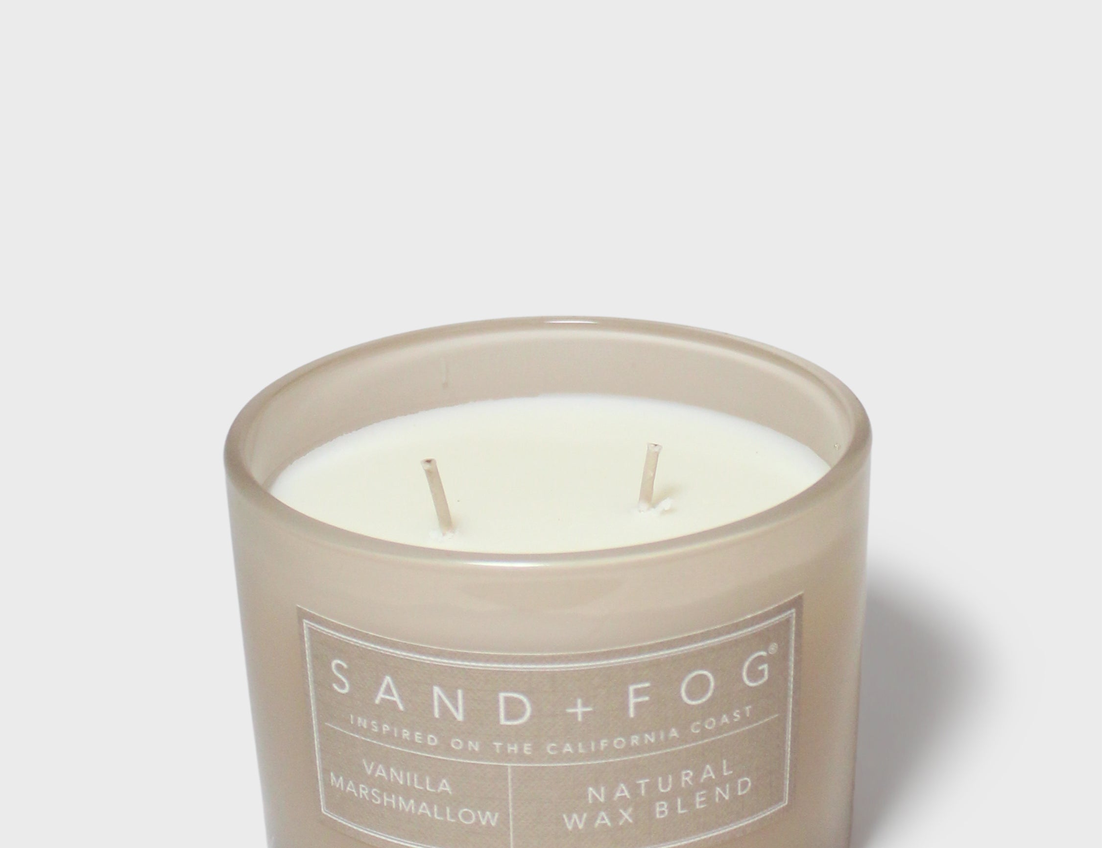 Vanilla marshmallow scented candle with two exposed wicks in taupe glass, SAND + FOG